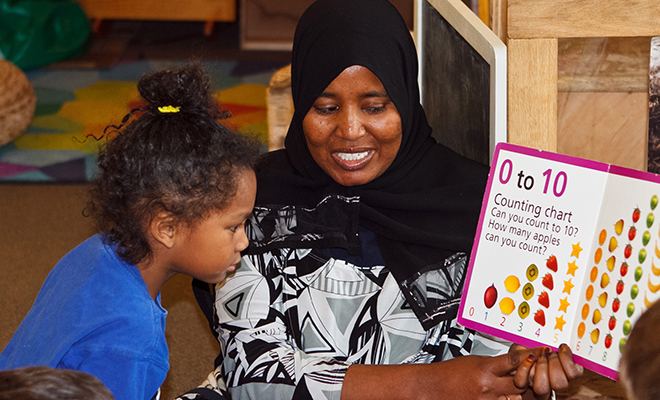 Dual Language Early Childhood Education Educator Reading the Soy Bilingue Book