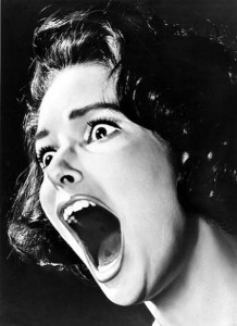  black and white photo from the fifties of woman screaming 
