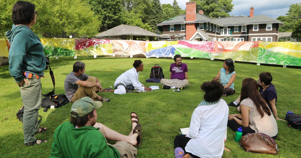 Students sitting in grass
